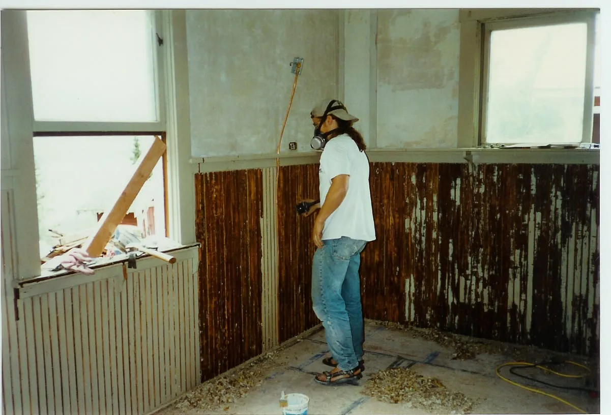 Scraping old paint in living room 1996
